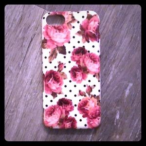 A iPhone 8 case with flowers and polkadots!